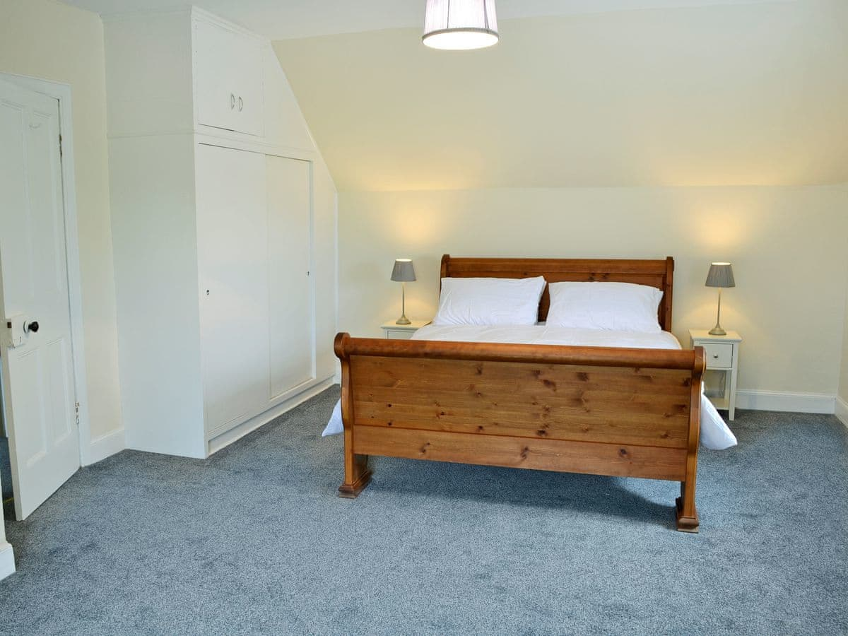 Relaxing double bedroom with sleigh bed | Halleaths Home Farm, Lochmaben
